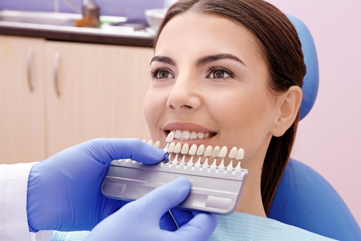 dentist-checking-selecting-color-young-woman-s-teeth (1)